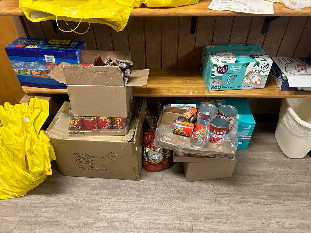 A pic of food and essentials being gathered in the collection area before being blessed this Sunday.